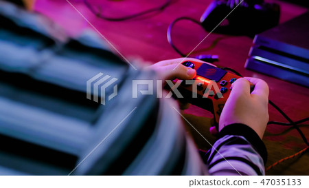 Man playing video game 47035133