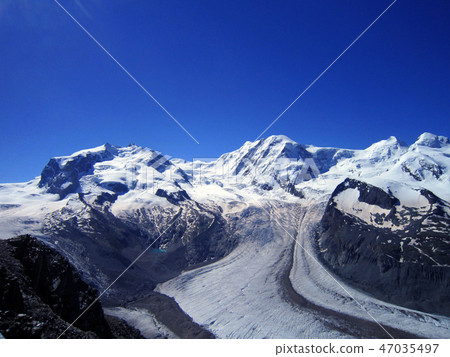 Snow peak mountain view of Europe alpine summer Snow peak mountain view of Europe alpine summer 47035497