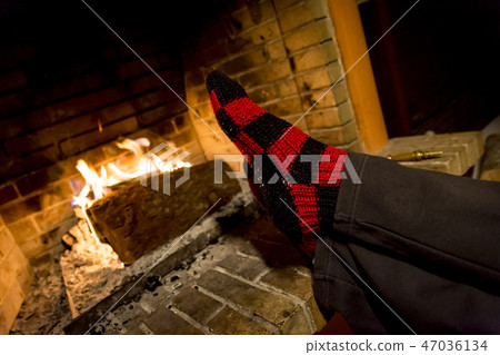 warming in a fireplace warming in a fireplace 47036134