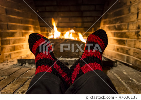 warming in a fireplace warming in a fireplace 47036135