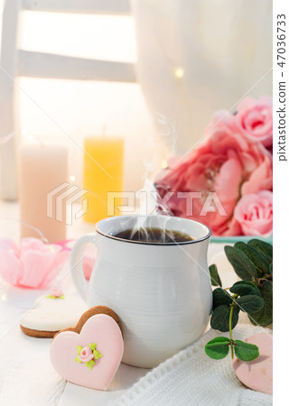 Heart cookies with cup of coffee on wooden background with plaid, copy space 47036733