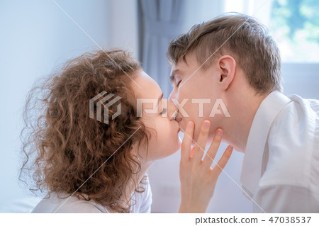 Couples are kissing passionately on the bedroom Couples are kissing passionately on the bedroom 47038537