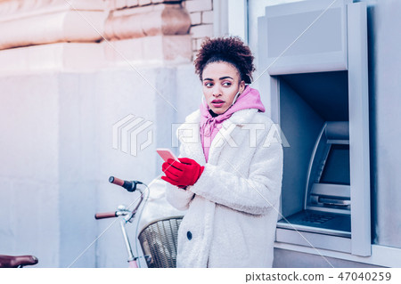 Attentive young female person being deep in thoughts Attentive young female person being deep in thoughts 47040259