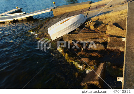 metal boat upside down on shore metal boat upside down on shore 47040831