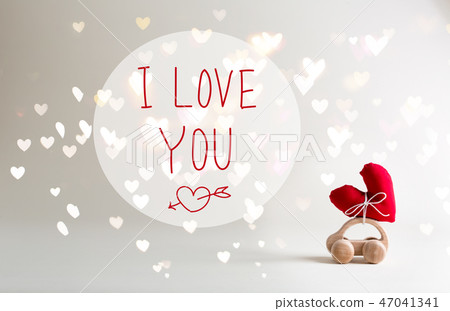 I Love You message with toy car carrying a heart I Love You message with toy car carrying a heart 47041341