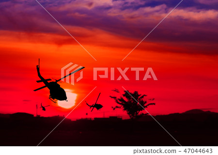 silhouette of helicopter on sunset silhouette of helicopter on sunset 47044643