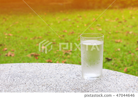 glass of water ice on terrazzo floor table glass of water ice on terrazzo floor table 47044646