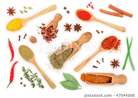 mix of spices in wooden spoon isolated on a white background. Top view. Flat lay. Set or collection 47044806