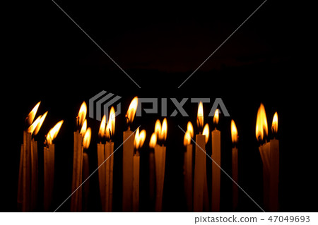 Candle flame set isolated in black background. 47049693