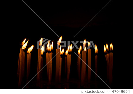 Candle flame set isolated in black background. 47049694