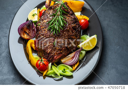 Club Beef steak with pepper sauce and Grilled vegetables on dark wooden background. Roas beef. Copy Club Beef steak with pepper sauce and Grilled vegetables on dark wooden background. Roas beef. Copy 47050718