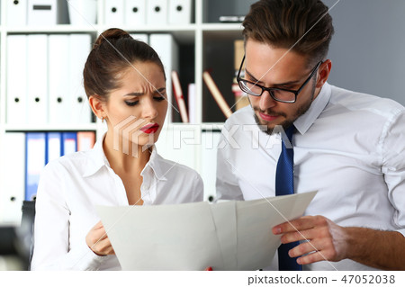 Group of modern businesspeople in office debate on financial issue Group of modern businesspeople in office debate on financial issue 47052038