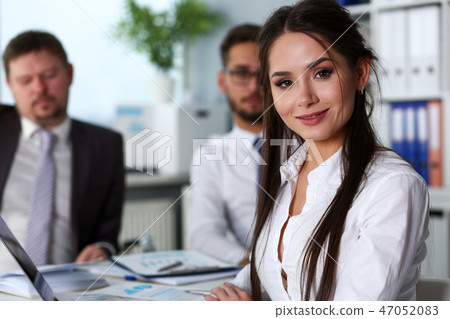 Beautiful smiling brunette clerk girl at workplace Beautiful smiling brunette clerk girl at workplace 47052083