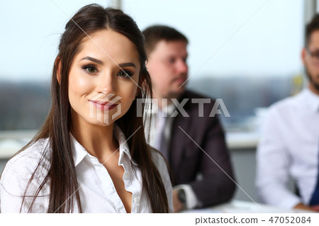 Beautiful smiling brunette clerk girl at workplace Beautiful smiling brunette clerk girl at workplace 47052084