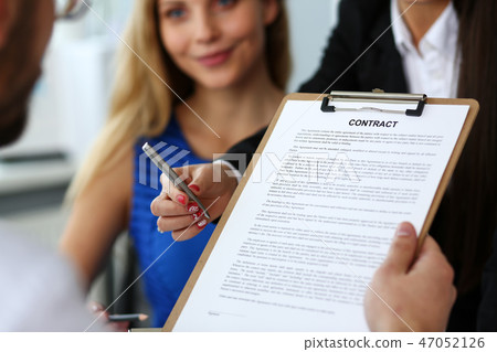 Female arm offer contract form on clipboard pad Female arm offer contract form on clipboard pad 47052126