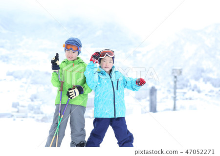 Children enjoying skiing 47052271