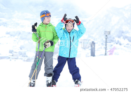 Children enjoying skiing 47052275