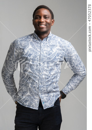 portrait of smiling dark-skinned young man isolated on white background 47052378