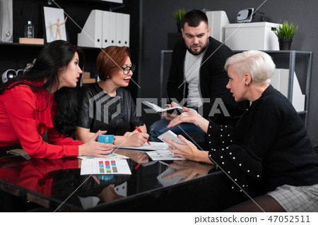 Office workers discuss their project over Cup of tea Office workers discuss their project over Cup of tea 47052511