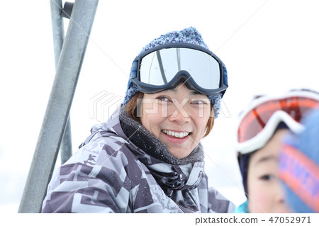 Parents and children enjoying skiing Parents and children enjoying skiing 47052971