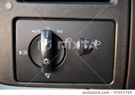 controls near the steering wheel in a modern car 47055789