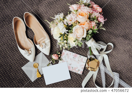 Wedding floristics and details. Wedding invitations on floor. 47056672