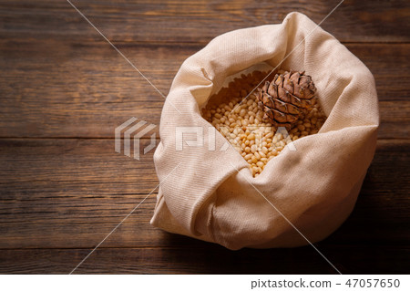 The kernel of cedar nuts in a bag. 47057650