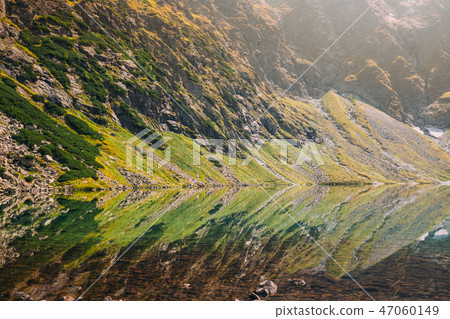 Tatra National Park, Poland. Calm Lake Czarny Staw under Rysy An Tatra National Park, Poland. Calm Lake Czarny Staw under Rysy An 47060149