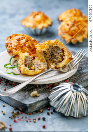 Delicious mini pie stuffed with minced meat. Delicious mini pie stuffed with minced meat. 47061593