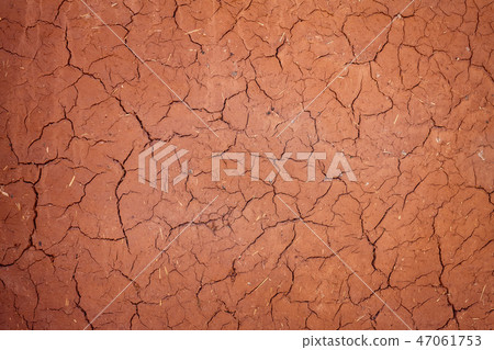 Texture cracked clay surface. Adobe african buildind wall Texture cracked clay surface. Adobe african buildind wall 47061753