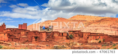Old berber architecture in High Atlas Mountains region in Morocco. Houses of clay at the foot of the Old berber architecture in High Atlas Mountains region in Morocco. Houses of clay at the foot of the 47061763