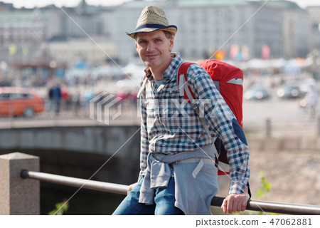 Tourist with backpack in city Tourist with backpack in city 47062881