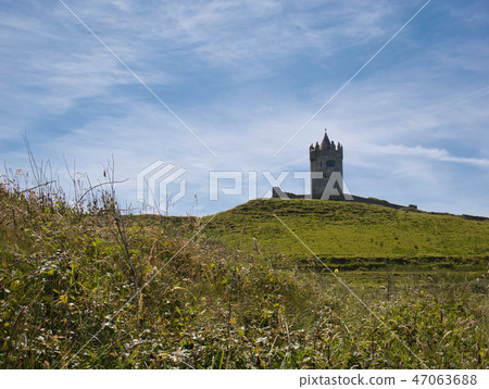 Meadow with the tower from a Castle in Ireland Meadow with the tower from a Castle in Ireland 47063688