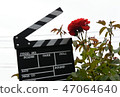 A hand with clapperboard 47064640