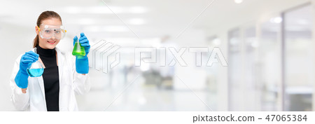 Scientist or chemist holds test tube in laboratory 47065384