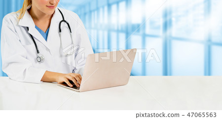 Doctor using laptop computer at the hospital. Doctor using laptop computer at the hospital. 47065563