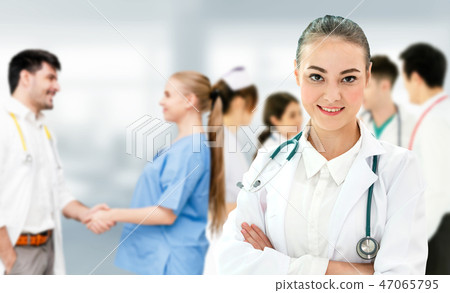 Doctor working in hospital with other doctors. 47065795