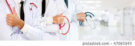 Doctor working in hospital with other doctors. 47065843