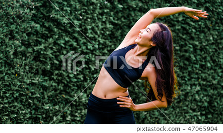 Young sport woman doing morning exercise in park. Young sport woman doing morning exercise in park. 47065904