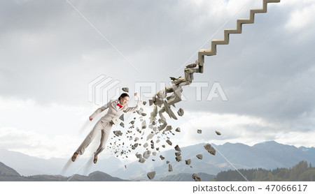 Woman breaking ladder 47066617