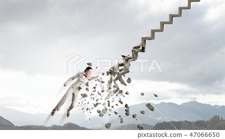 Woman breaking ladder Woman breaking ladder 47066650
