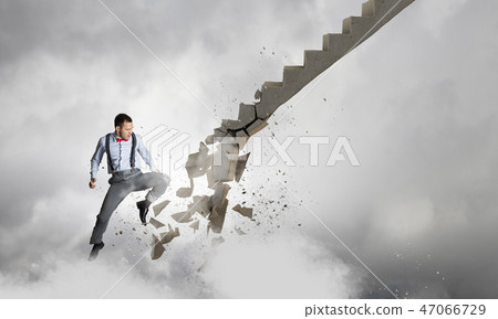 Man breaking ladder Man breaking ladder 47066729