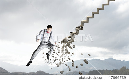 Man breaking ladder Man breaking ladder 47066789