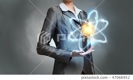 Woman scientist presenting atom research concept 47066952
