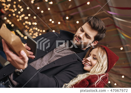 Couple taking pictures of mexican food. The concept of Mexican cuisine. Couple taking pictures of mexican food. The concept of Mexican cuisine. 47067972