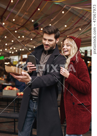 Couple taking pictures of mexican food. The concept of Mexican cuisine. Couple taking pictures of mexican food. The concept of Mexican cuisine. 47067973