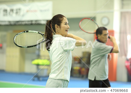 60s and 60s playing tennis 47069668