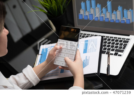 Businesswoman investment consultant analyzing company annual financial report balance sheet Businesswoman investment consultant analyzing company annual financial report balance sheet 47071239