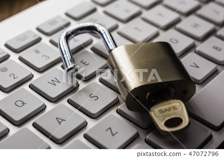 Open lock with word SAFE on key on keyboard. 47072796