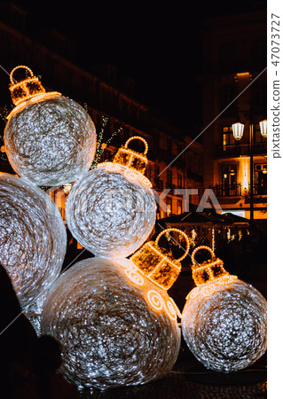 Christmas Decorations at Restauradores Square. Huge illuminated christmas bulbs, glitter balls 47073727